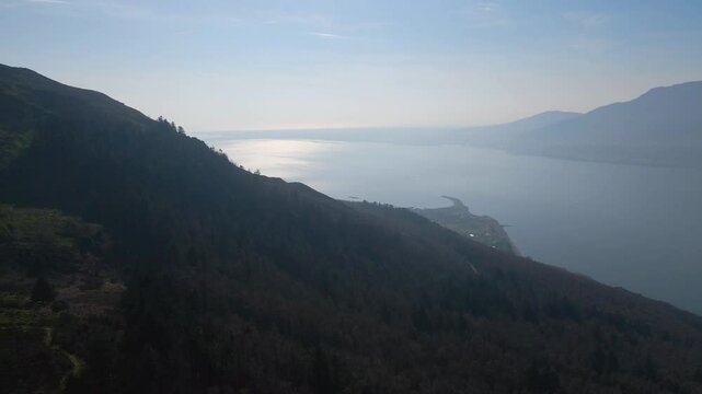 Drone shot of beautiful lake from mountain top forest. Carlingford Lough, Down, Northern Ireland