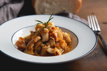 Stewed squid with onions and carrots