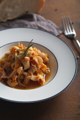 Stewed squid with onions and carrots