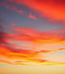Fototapeta premium Fiery sunset paints the sky with vibrant red clouds, streaks of orange and gold, dusk, amazing