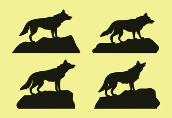 Set of four isolated silhouettes of wolves standing on rocks vector design