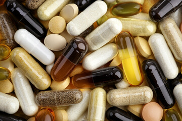 Exploring a colorful assortment of vitamins and supplements arranged in a chaotic pattern on a flat surface