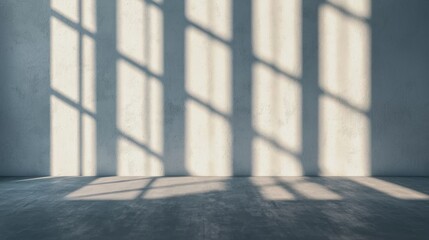 Sunlight streaming through a window, casting shadows on a concrete floor.