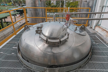Stainless vertical steel tanks with equipment tank chemical cellar at the with stainless steel...