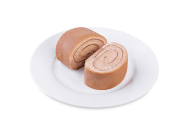 Chocolate crepe rolls with chocolate whipped cream filling in a plate on a white isolated background