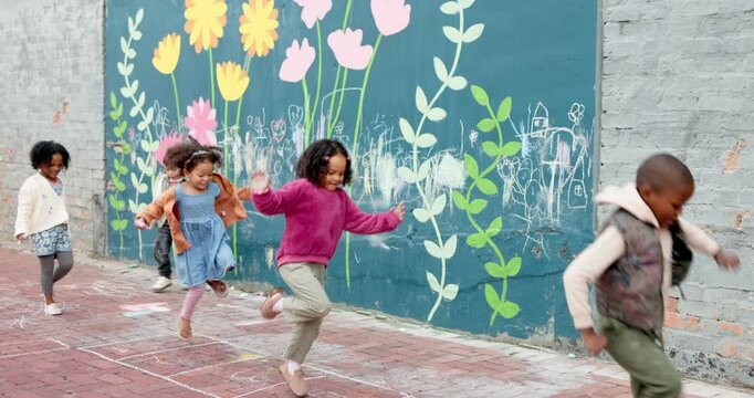 School, children and playing hopscotch on playground with jumping, education break and fun activity. Montessori, people and balance game outdoor for gross motor skills, recess and agility development