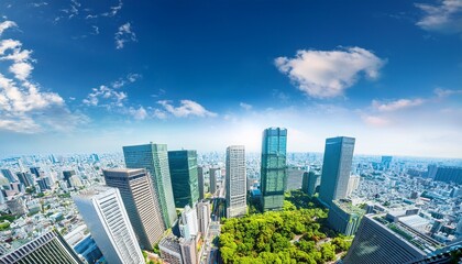 Obraz premium asia business concept for real estate corporate construction and ecology looking up view of panoramic modern city skyline with blue sky and green tree in shinjuku tokyo japan