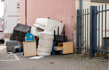 Pile of bulky waste with furniture at the side of the road