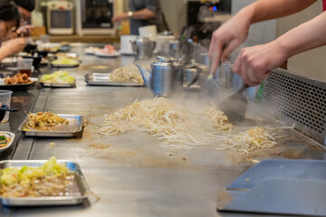 A sizzling plate of bean sprout teppanyaki captures the essence of Japanese-style street food—simple, aromatic, and full of texture. Lightly stir-fried on a hot iron griddle, the bean sprouts