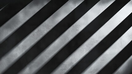 Obraz premium A series of diagonal shadows cast on a textured surface, creating a striking interplay of light and dark.