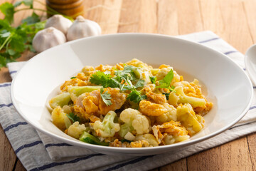 Stir fried Cauliflower with eggs in a plate.Healthy low carb diet.