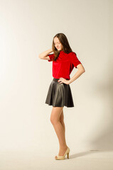 Portrait of young beautiful girl. Photo-shoot executed in the studio.