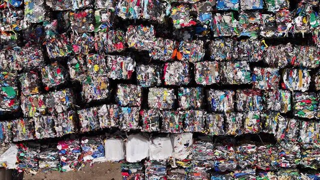Piles of sorted recycled materials at a waste management facility