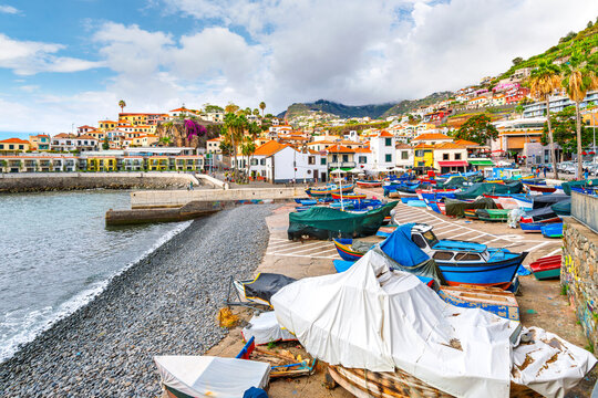 View from the pebble beach and marina of the colorful seaside village of Camara de Lobos, Portugal, on the Atlantic island of Madeira.