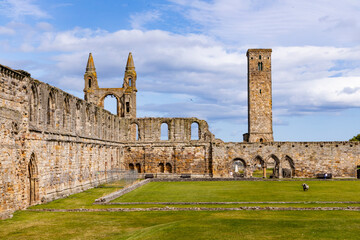 The ruins of St Andrews Cathedral overlook the sea, surrounded by ancient tombs and old stone...