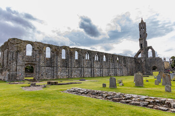 The ruins of St Andrews Cathedral overlook the sea, surrounded by ancient tombs and old stone...
