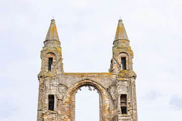 The ruins of St Andrews Cathedral overlook the sea, surrounded by ancient tombs and old stone...