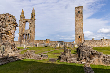 The ruins of St Andrews Cathedral overlook the sea, surrounded by ancient tombs and old stone...