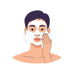 Young man applying facial cleanser with foam on his face in a skincare routine