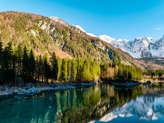 Fototapeta premium Laghi di Fusine Mirror Reflection of Mangart Mountain of Slovenia, Tarvisio Italy