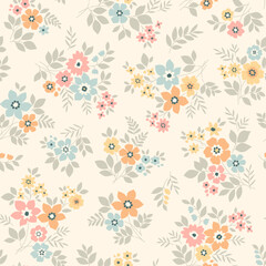 Beautiful floral pattern in small vintage flowers. Small blue, pink and yellow flowers. Ivory beige background. Ditsy print. Floral seamless background. Gentle template for fashion prints. Stock 
