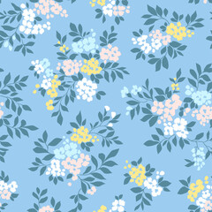 Beautiful floral pattern in small vintage flowers. Small pastel yellow white and pink flowers. Light blue background. Ditsy print. Floral seamless background. Elegant template for fashion prints. 
