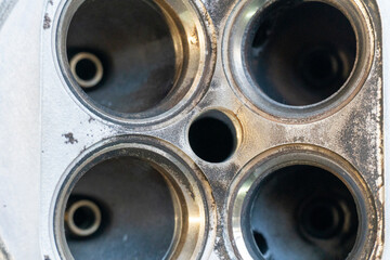 The cylinder valve and Cylinder head. Damaged cylinder head, worn valves, damaged engine