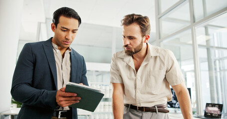 Men, tablet and discussion in office for project, partnership or review at biohacking startup. Engineer, consulting and digital touchscreen for brain scan, app or research at neurotechnology company