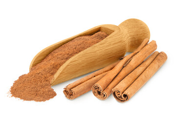 Cinnamon sticks with powder in wooden scoop isolated on white background with full depth of field