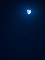 Naklejka premium Night sky with a rare blue moon and twinkling stars