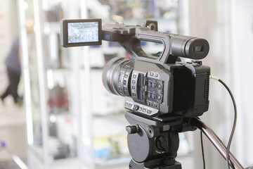 Professional video camera on tripod