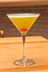 Martini cocktail, Yellow cocktail in a Martini glass, refreshing drink