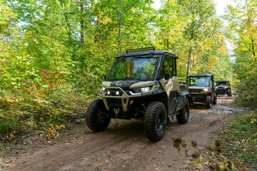 ATV, riding on trail through wooded scenery, north woods all terrain vehicle, UTV © Amanda