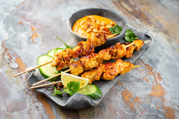 Sate Ayam- Grilled chicken satay sate skewers with peanut dipping spicy sauce, steamed rice and...