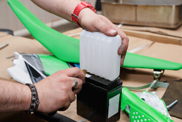 The process of refueling a new motorcycle battery.