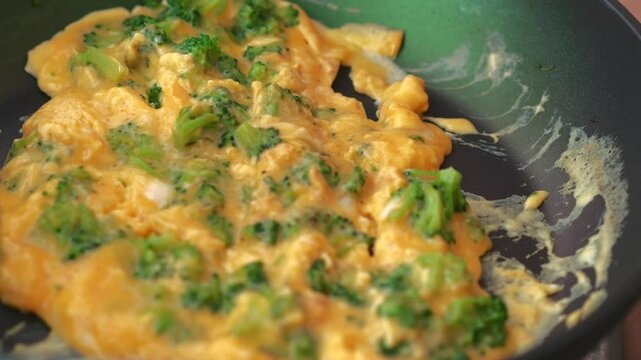 Fried omelette with broccoli.
Cheese omelette with fresh vegetables.
Fried vegetables with eggs for breakfast.
Addition to omelette.