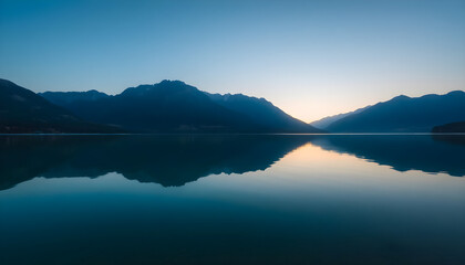 large body of water surrounded by mountains