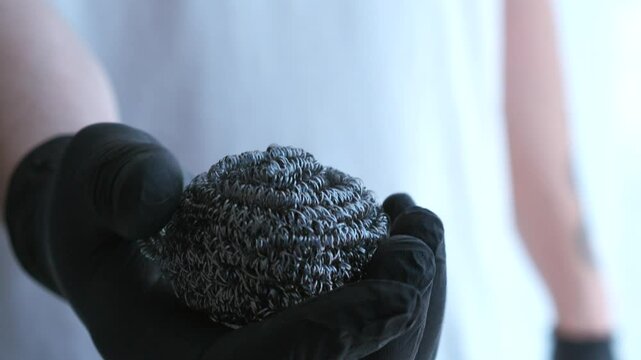 A man in black rubber gloves holds brushes for cleaning the house.
Cleaning products and equipment for an apartment.
Apartment cleaning service.