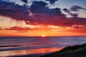 sunset on the beach with dramatic cloud