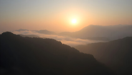 Fototapeta premium sun is setting over a mountain range