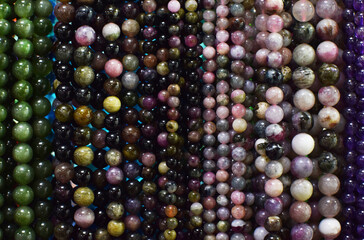 Strands of colorful natural beads at the gem market.