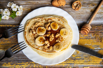 American pancakes with honey and walnuts..