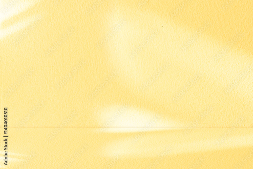 Aufkleber Yellow background with light and shadow of leaf effect on studio concrete wall texture for Autumn banner,Backdrop empty kitchen cement wall room with blur natural sunlight on for floor product design.