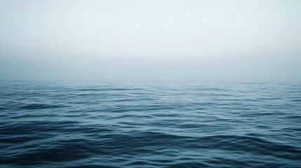 Fototapeta premium Foggy ocean view with water surface and hazy sky.