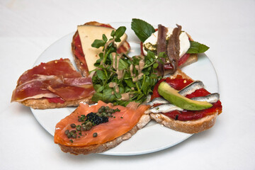 Traditional Spanish tapas, a variety of Spanish tapas served on a slice of baguette to share