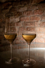 Visit of wine cellar, tasting of brut champagne sparkling wine produced by traditional method in underground caves close up