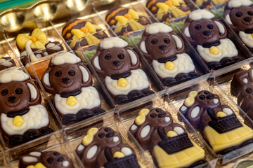 Various Easter-themed confectionery, marmalade chickens, chocolates and eggs, on display counter in old traditional candy shop in Vienna, Austria
