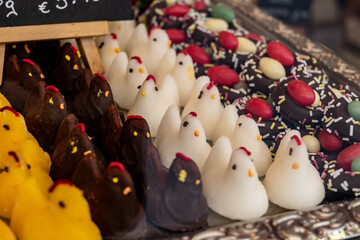 Various Easter-themed confectionery, marmalade chickens, chocolates and eggs, on display counter in old traditional candy shop in Vienna, Austria