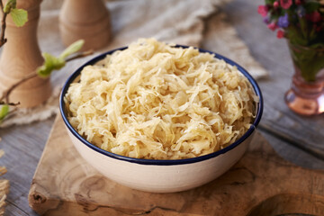 Fermented cabbage or sauerkraut in a bowl on a table