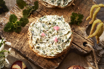 Nettle butter - homemade bread spread on slices of bun
